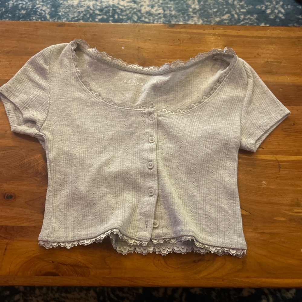 Grey top with buttons and lace on neckline
